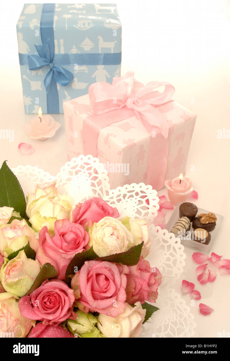 Blue and pink gift and a bouquet Stock Photo