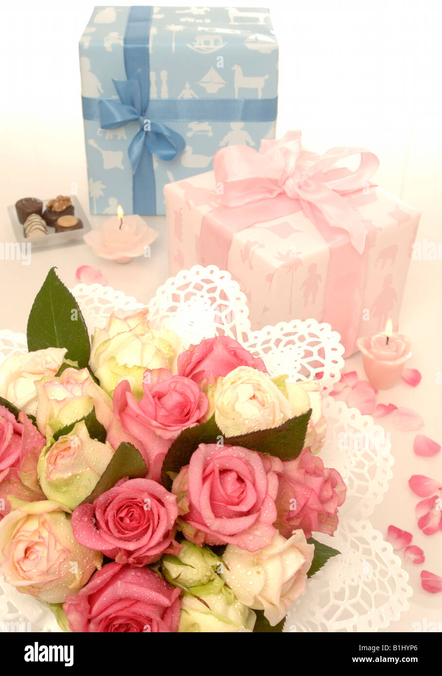 Blue and pink gift and a bouquet Stock Photo