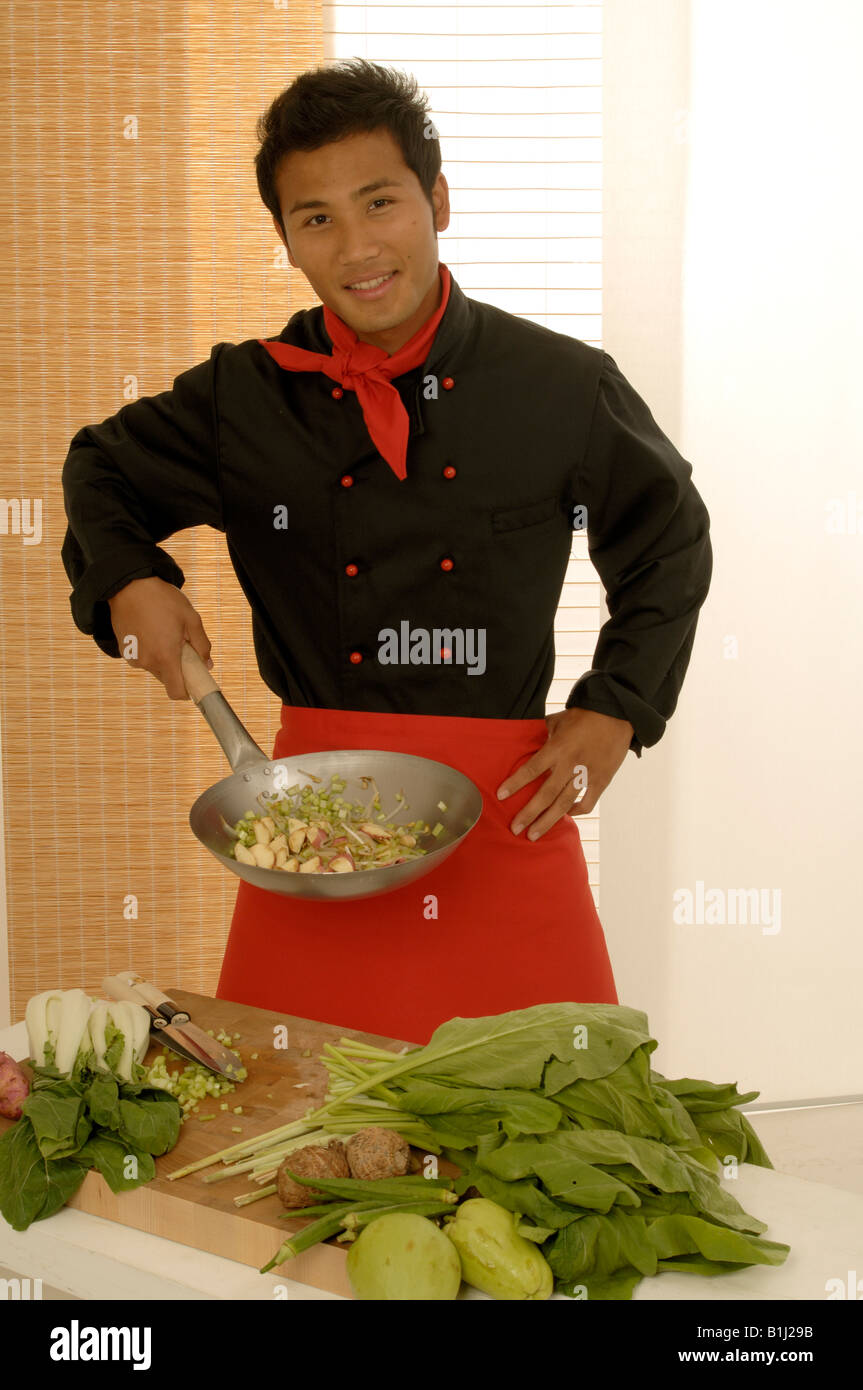 Asian chef with Wok Stock Photo Alamy