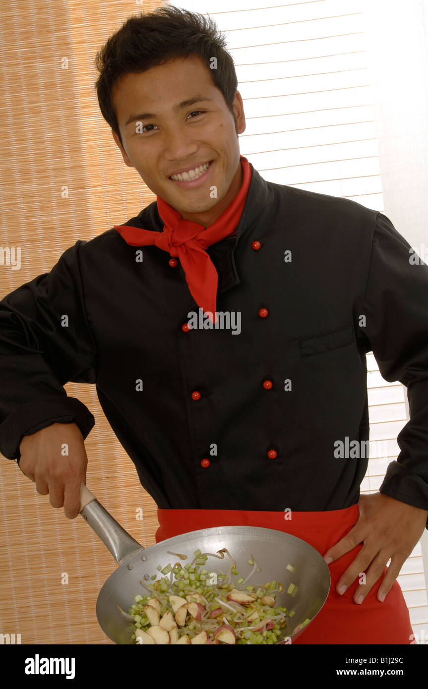 Asian chef with Wok Stock Photo Alamy