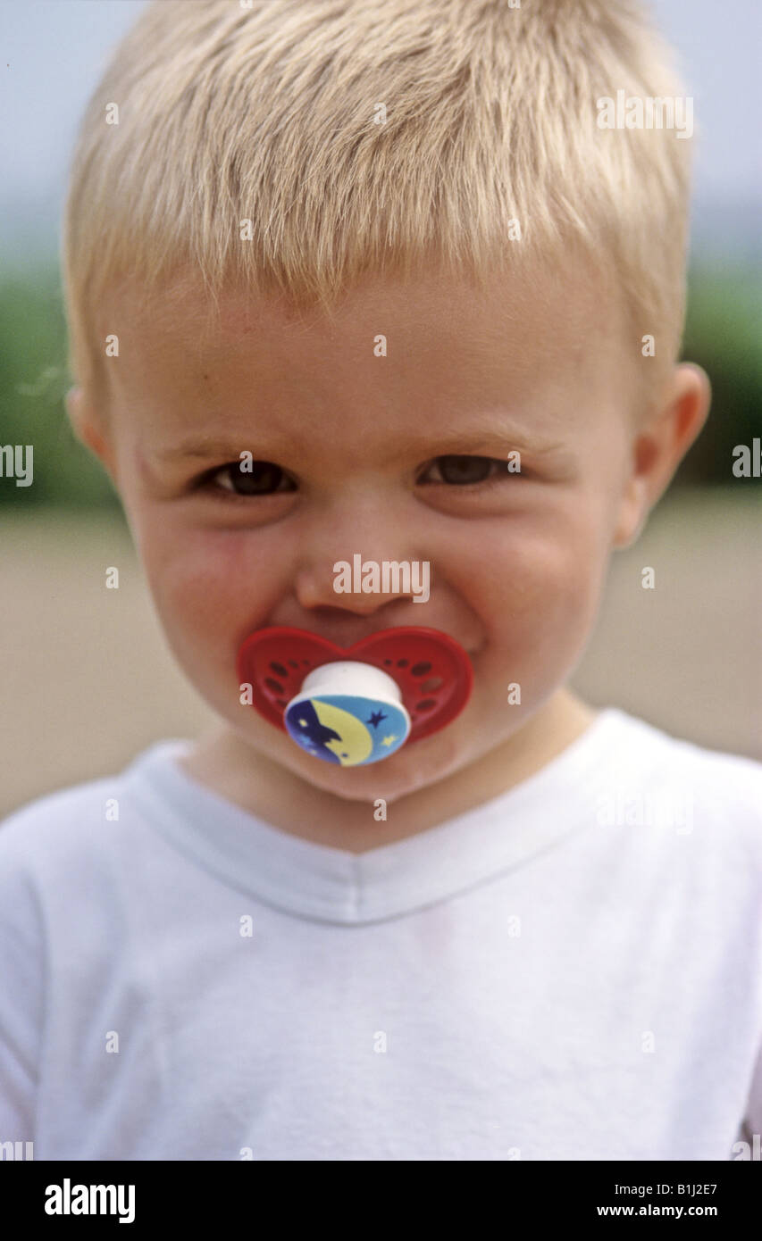 Boy toddler with dummy Stock Photo Alamy