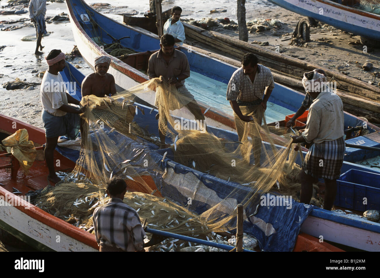 High angle view of fishermen pulling a fishing net, Kanyakumari