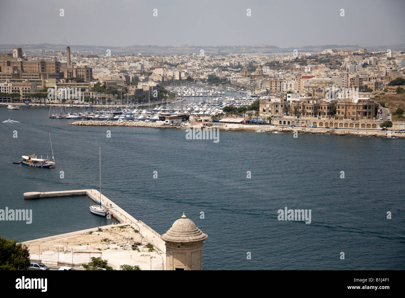 View north from St Michaels Bastion across harbour to boats and yachts of Ta Xbiex in Valetta or Valletta Malta Stock Photo