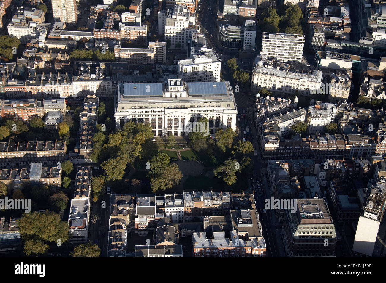 Aerial view north east of Victoria House Bloomsbury Square Gardens and inner city buildings