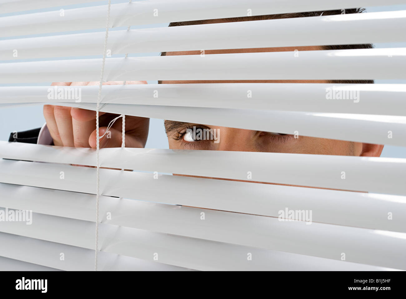 Peeking Through Blinds High Resolution Stock Photography and Images - Alamy