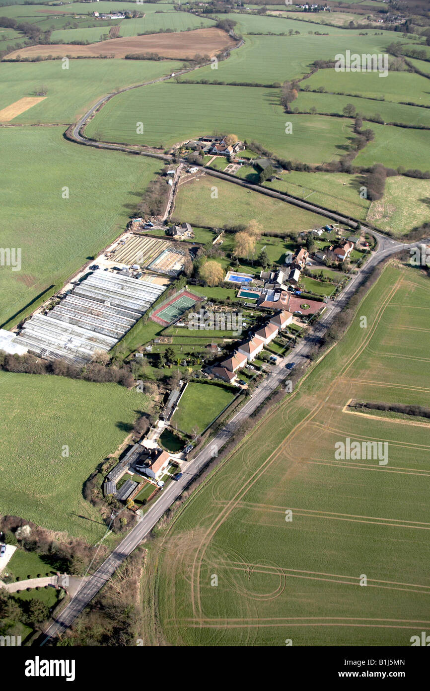 Aerial view north east of countryside farm near Essex RM4 England UK High level oblique Stock Photo