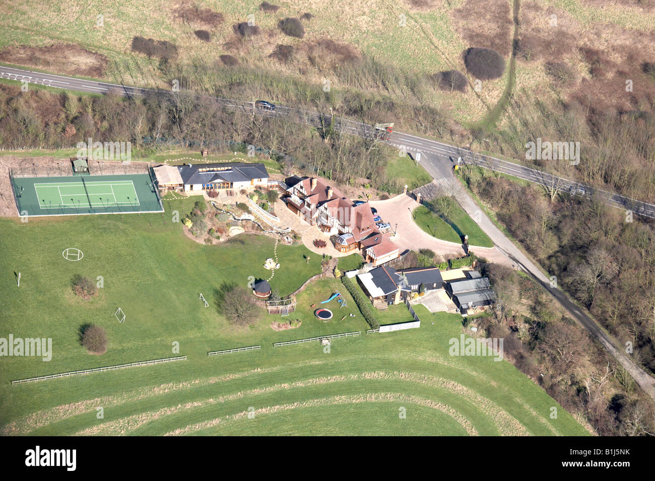 Aerial view north east of country house and tennis court Warley Road
