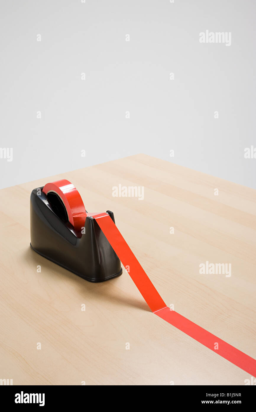 Red tape on desk Stock Photo