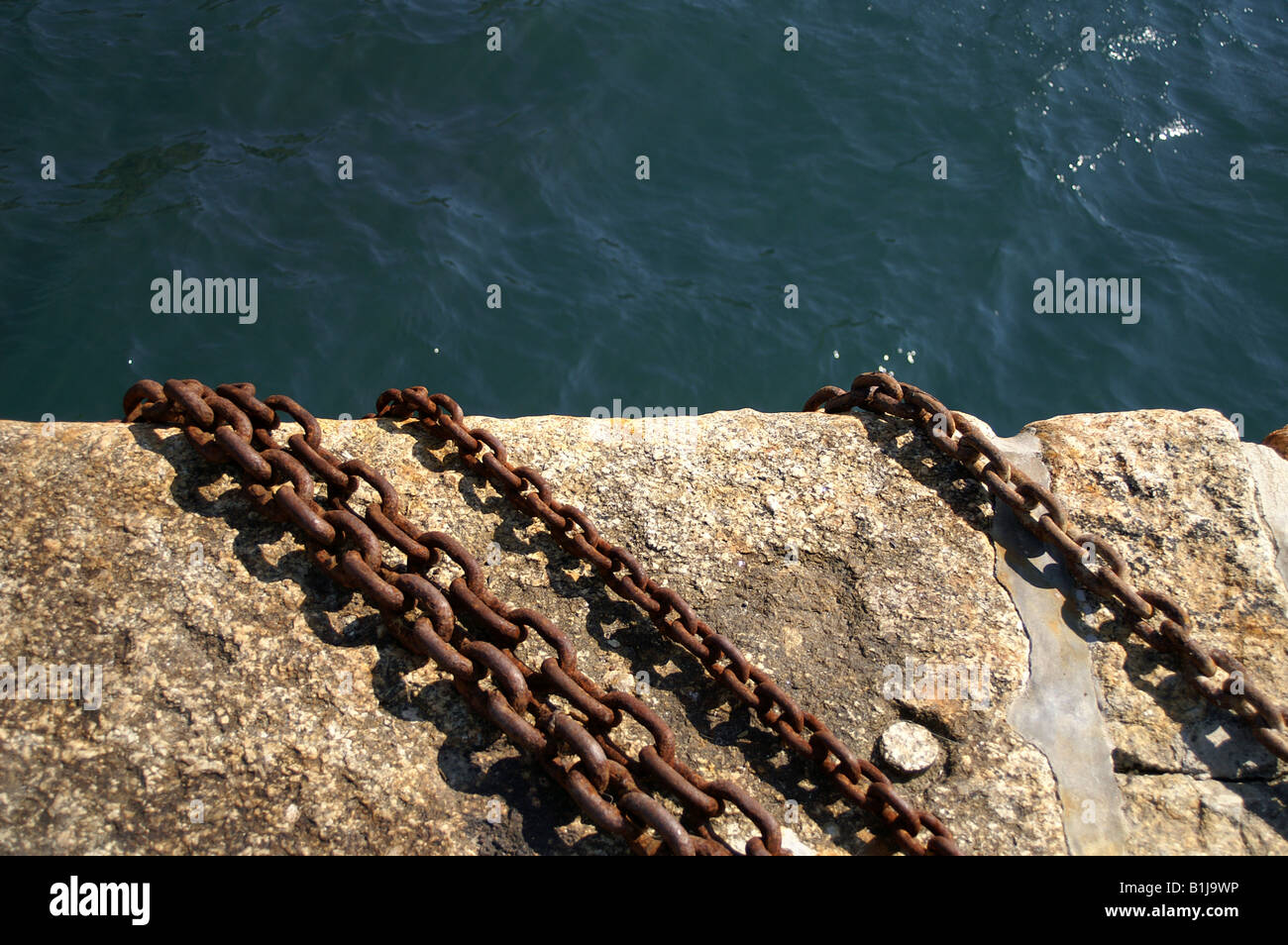 Quay side chains mullion Harbour cornwall Stock Photo - Alamy