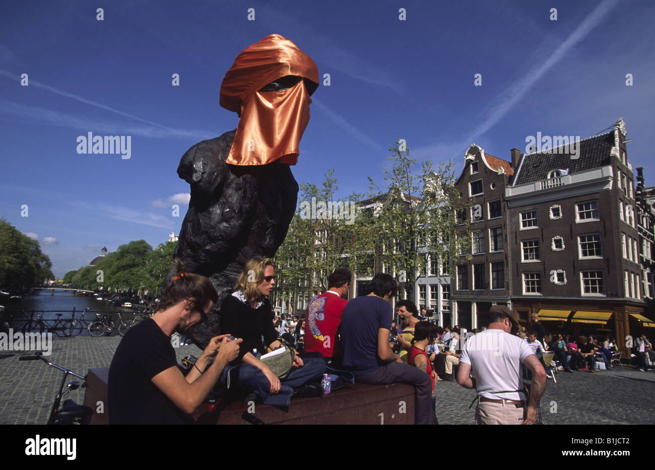Multatuli statue covered with orange Muslim 'Niqab' veil the year after the murder of Theo Van Gogh. Amsterdam, Netherlands. Stock Photo