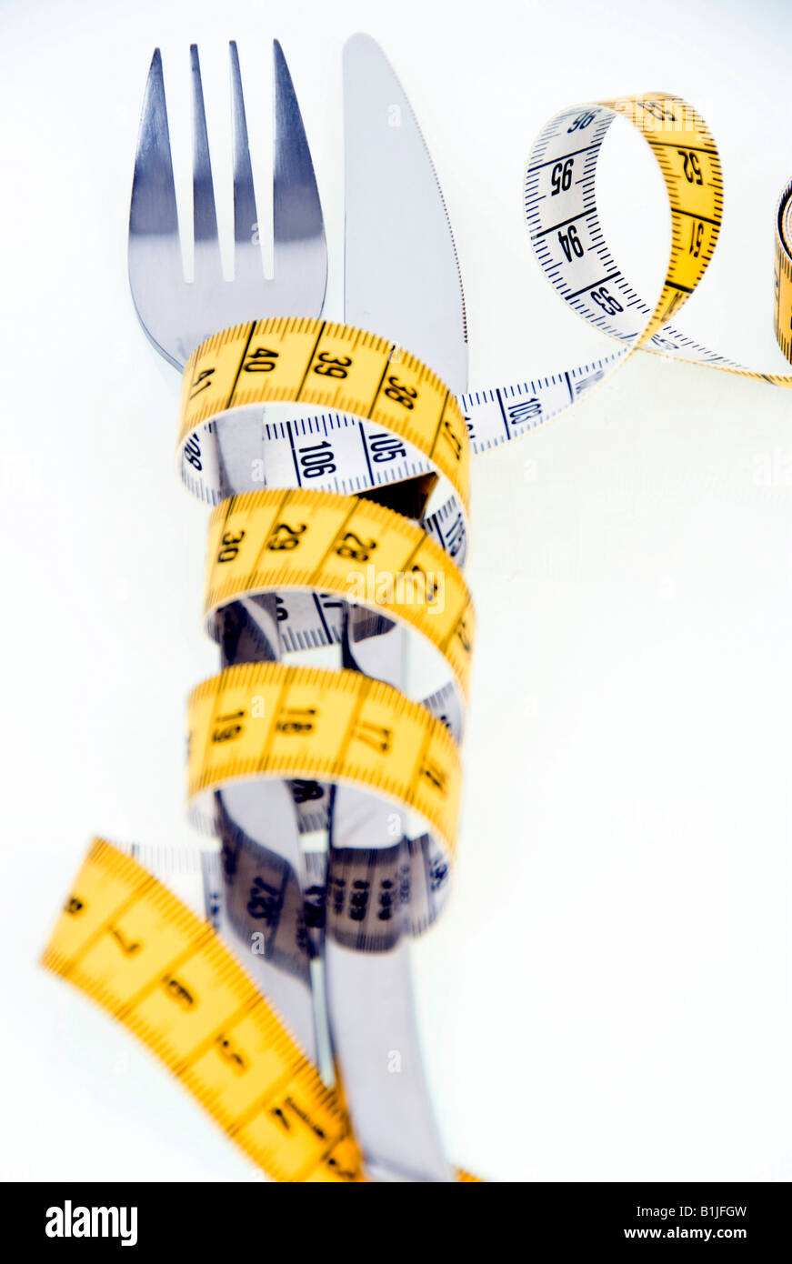symbolic for diet, knife and fork with tape measure Stock Photo Alamy