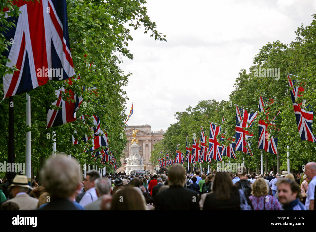 A Throng of People in the Mall Waiting for the Queen to Appear on the Balcony of Buckingham Palace After Trooping the Colour Stock Photo