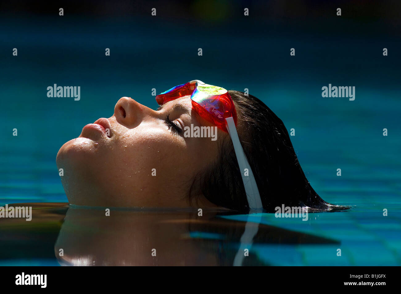 girl with diving goggle relaxes in swimming pool Stock Photo - Alamy