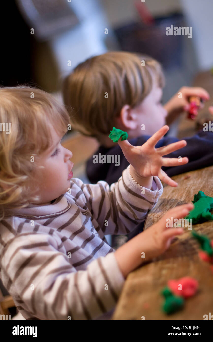 little children playing with play dough Stock Photo - Alamy