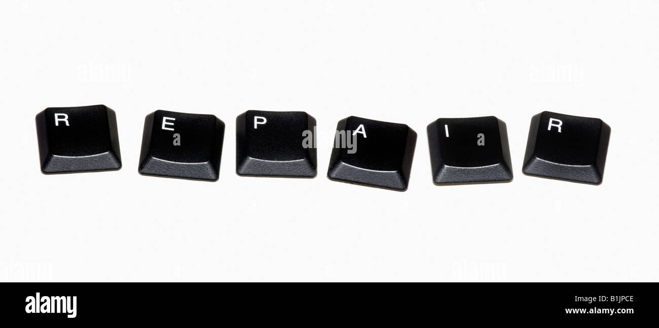 Computer keys arranged to spell the word 'Repair' on a white background. Stock Photo