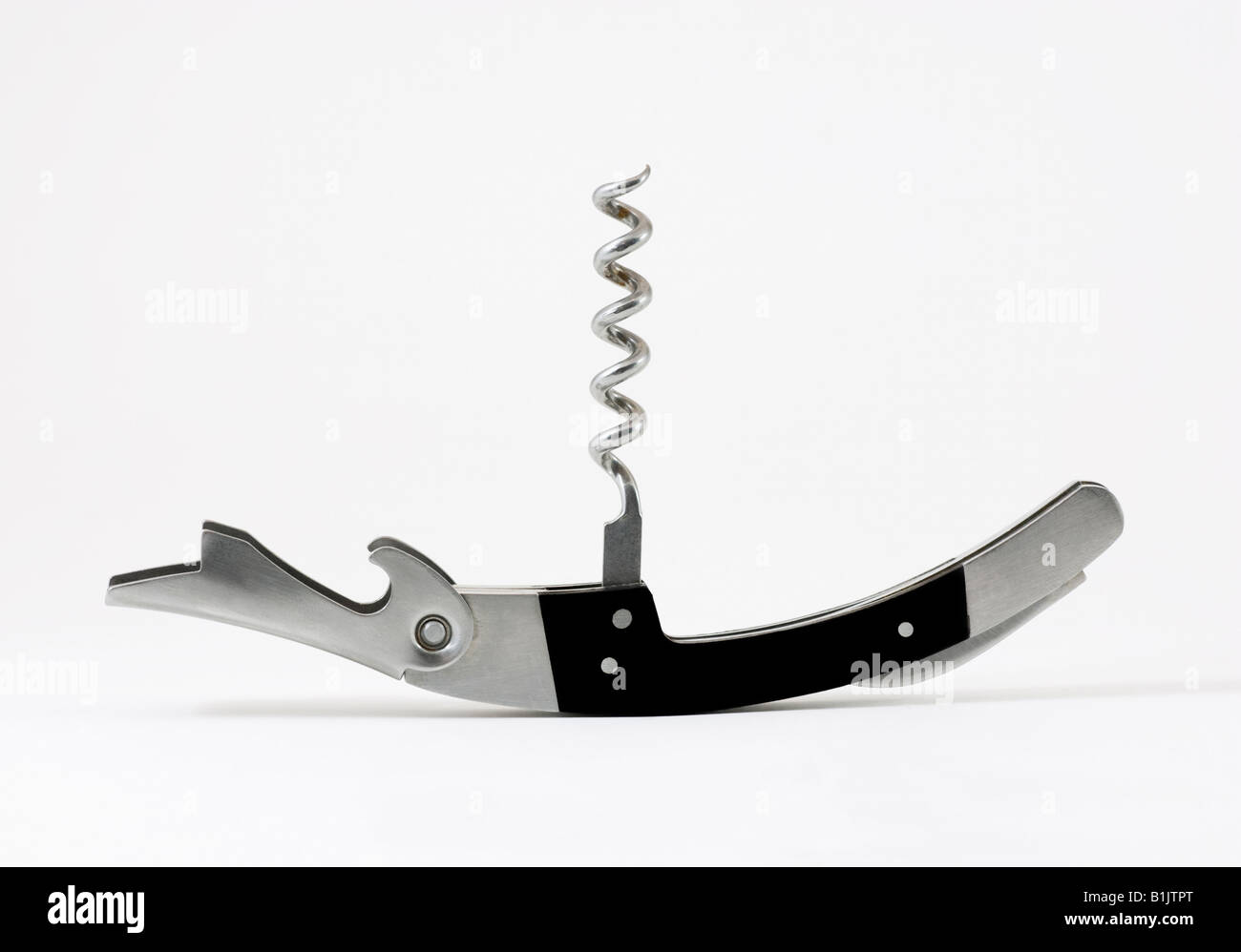 A corkscrew and bottle opener Stock Photo