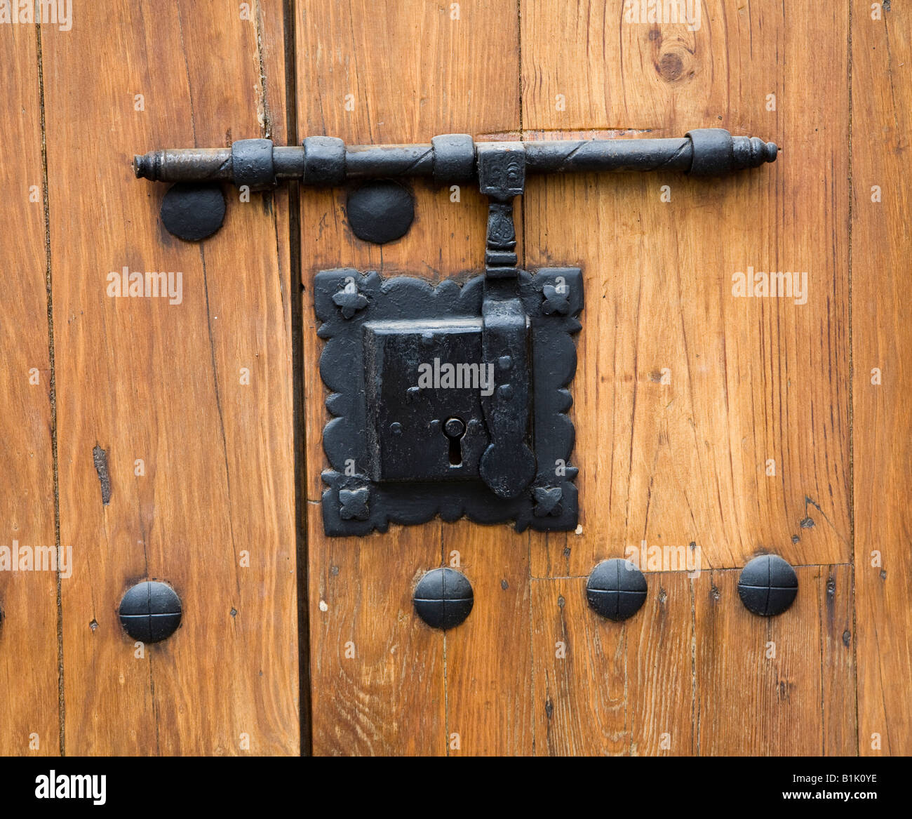 Old hasp and lock on wooden door Biblioteca Colombina Casa de Colon