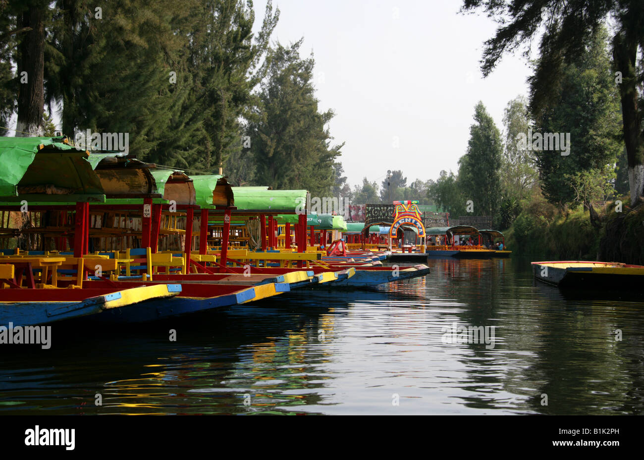 Colourful Trajinera Boats on the Canals of the Floating Gardens of Xochimilco Mexico City Stock Photo