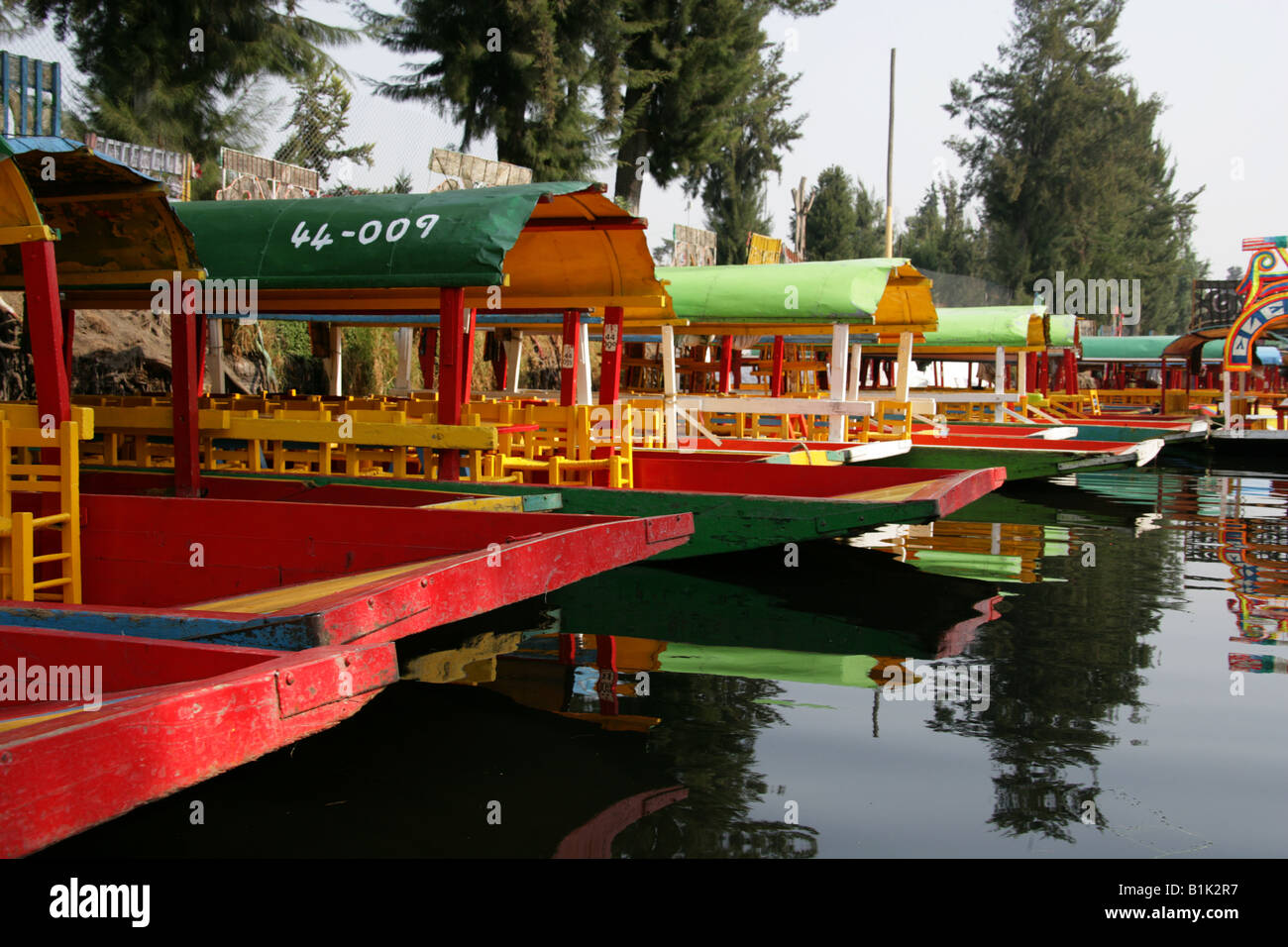 Colourful Trajinera Boats on the Canals of the Floating Gardens of Xochimilco Mexico City Stock Photo