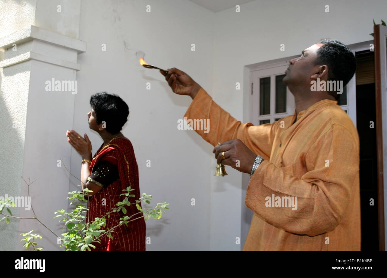 Brother and sister face east and pray directly to Surya the sun God