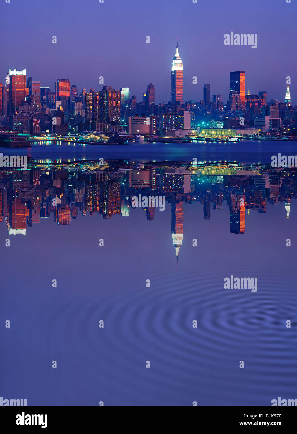 Empire State Building and New York skyline at night reflected in East ...