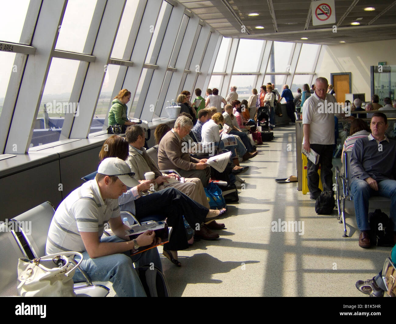 Waiting for a flight in the departures lounge at Dublin airport Ireland Stock Photo