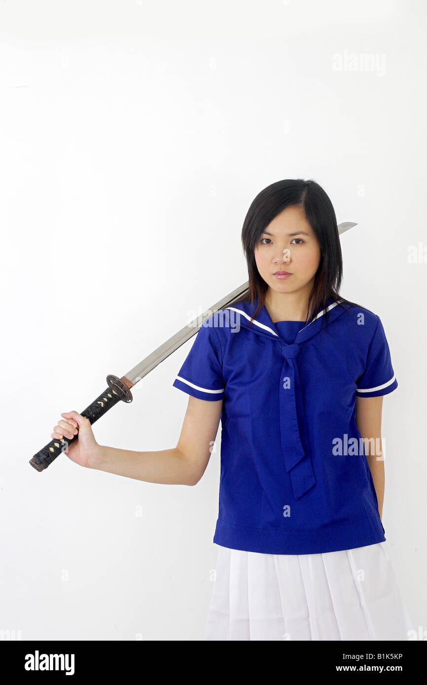 Girl woman japan japnese sword killer kill bill assassin knife school uniform crime Stock Photo