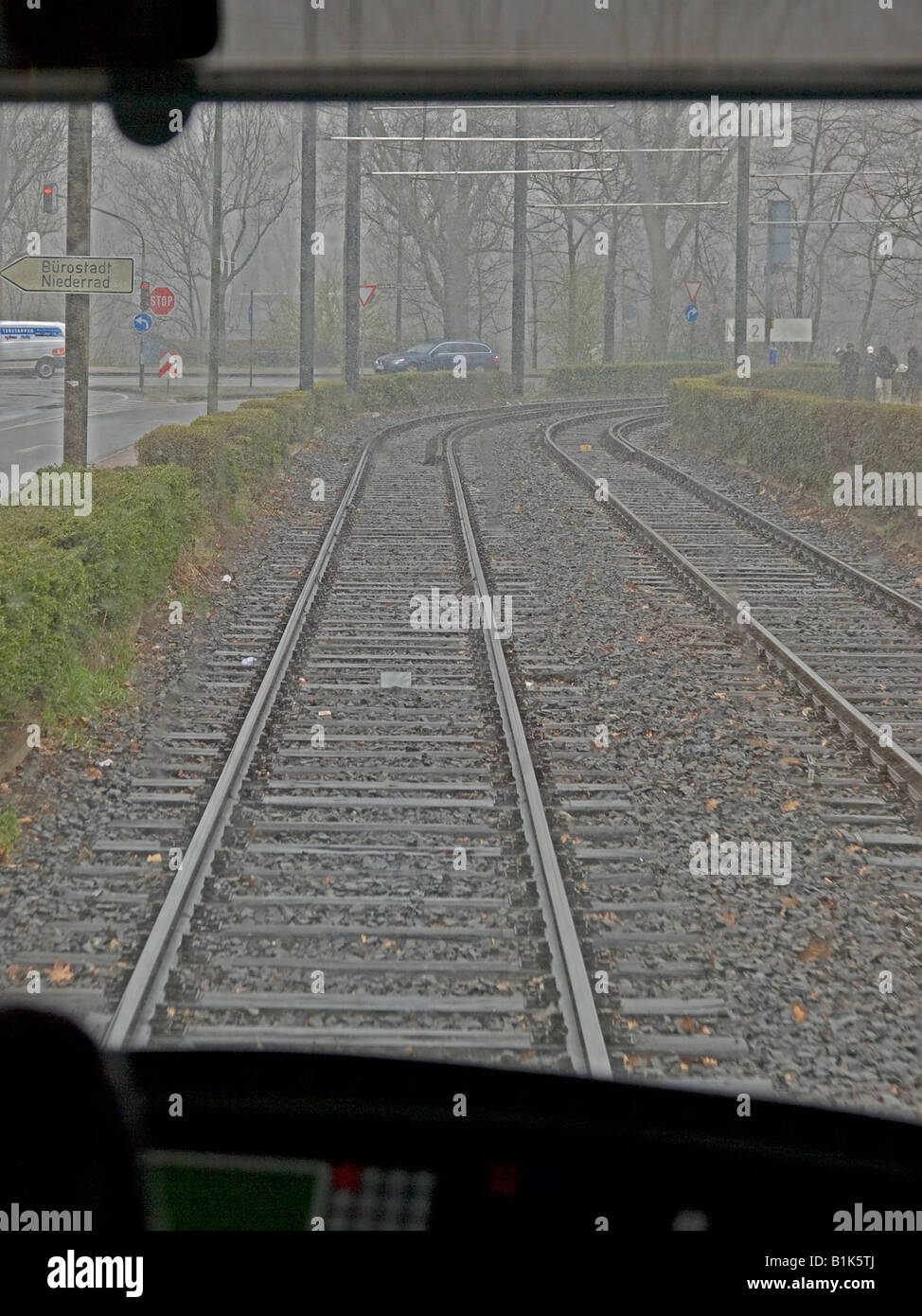 Empty Rails view from drivers cabin of a tram along empty rails on a rainy day tram ...
