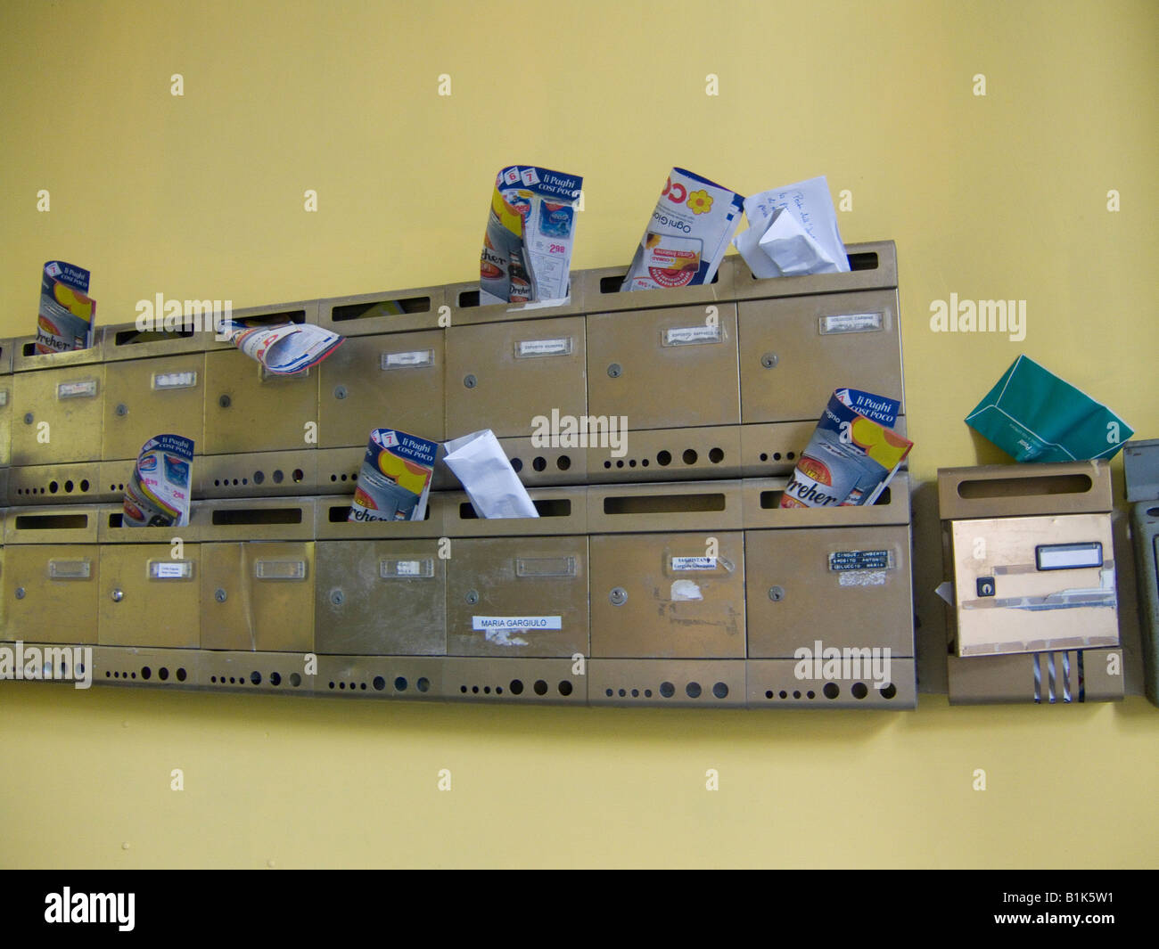 Junk mail in letterboxes Sorrento near Naples, Italy Stock Photo