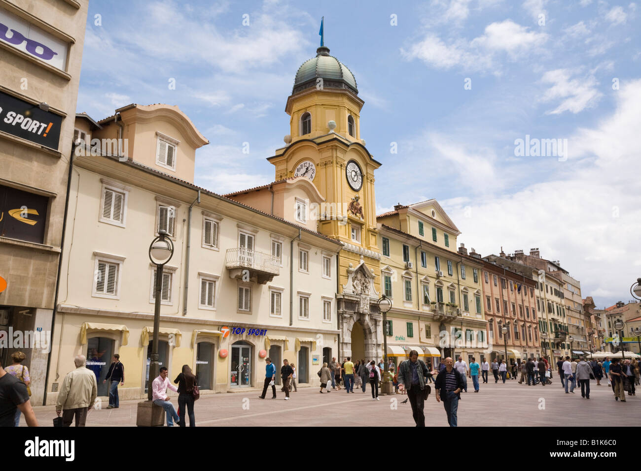 Civic Tower clock gateway in pedestrianised Korzo Street with people in city shopping district. Rijeka Istria Croatia Europe Stock Photo