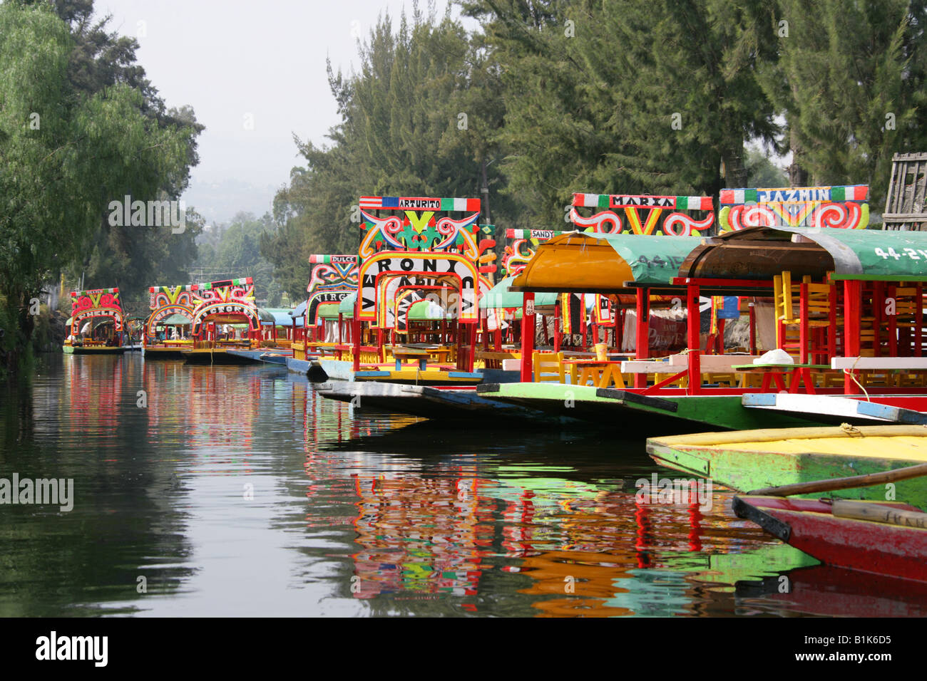 Colourful Trajinera Boats on the Canals of the Floating Gardens of Xochimilco, Mexico City Stock Photo