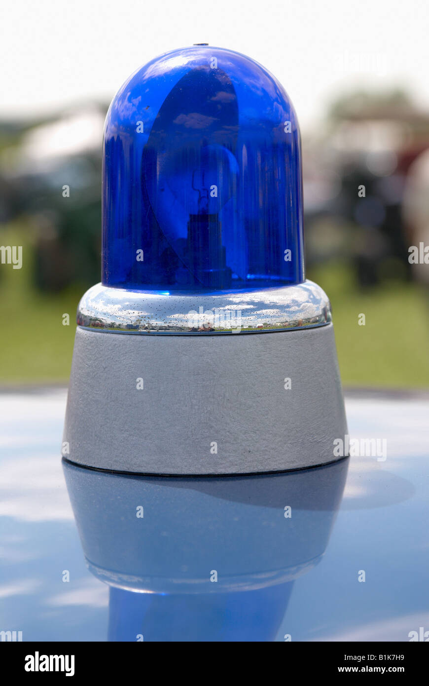 Blue light 1970 s police light on the roof of a Rover police