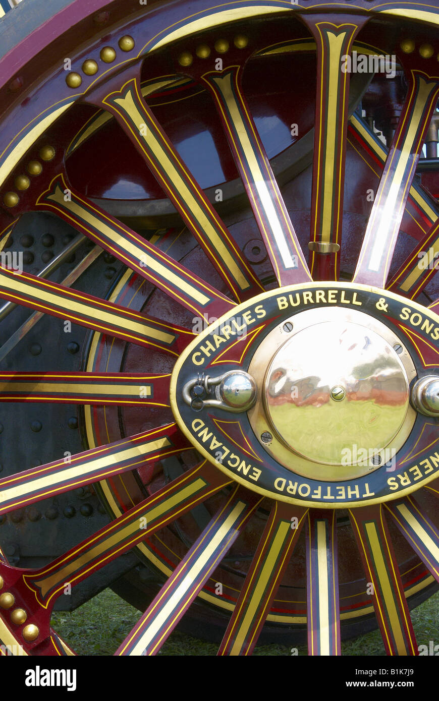 Painted wheel of a Burrell showmans engine - a type of steam traction engine used by travelling fairgrounds. Stock Photo