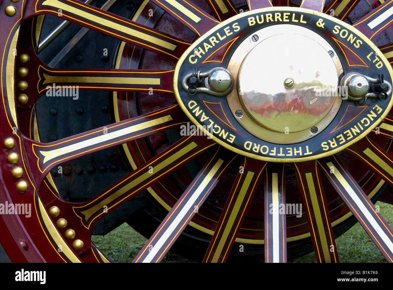 Painted wheel of a Burrell showmans engine - a type of steam traction engine used by travelling fairgrounds. Stock Photo