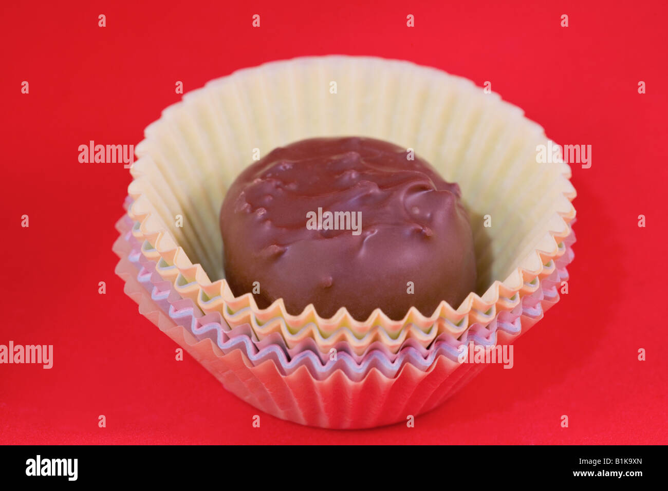 A single chocolate in a stack of paper cups Stock Photo - Alamy