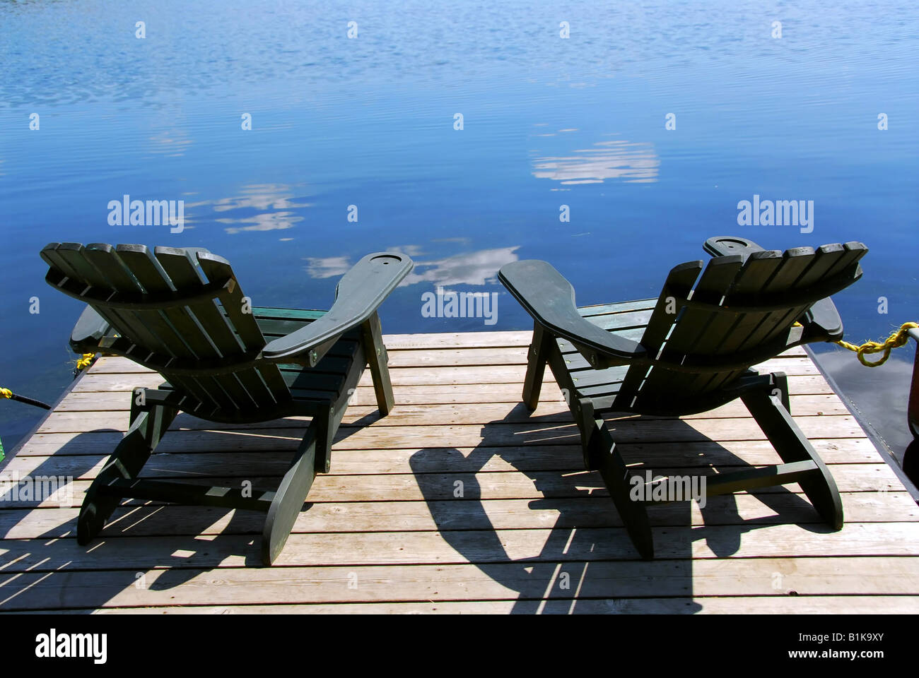 Two wooden chairs facing hi-res stock photography and images - Alamy