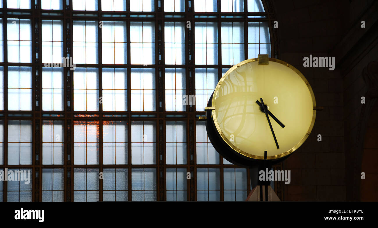 Big clock inside a train station with big window Stock Photo - Alamy