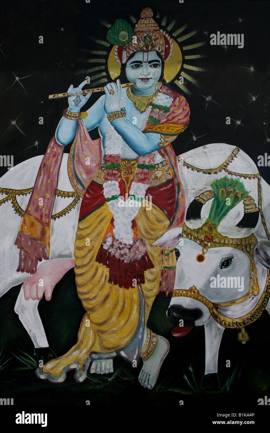 Mural on Hindu temple wall of Krishna playing his flute with his pet cow , India Stock Photo