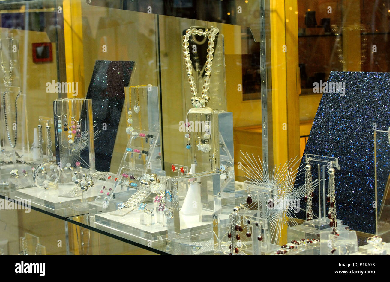 Jewellery on display in the window of a shop in Oxford Street London ...