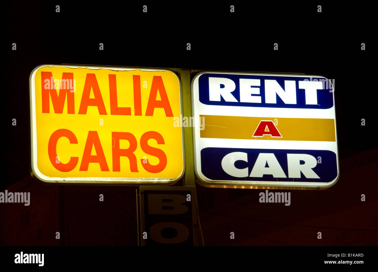 Tourist car hire MALIA CARS RENT A CAR sign Malia on the Greek Mediterranean island of Crete Stock Photo