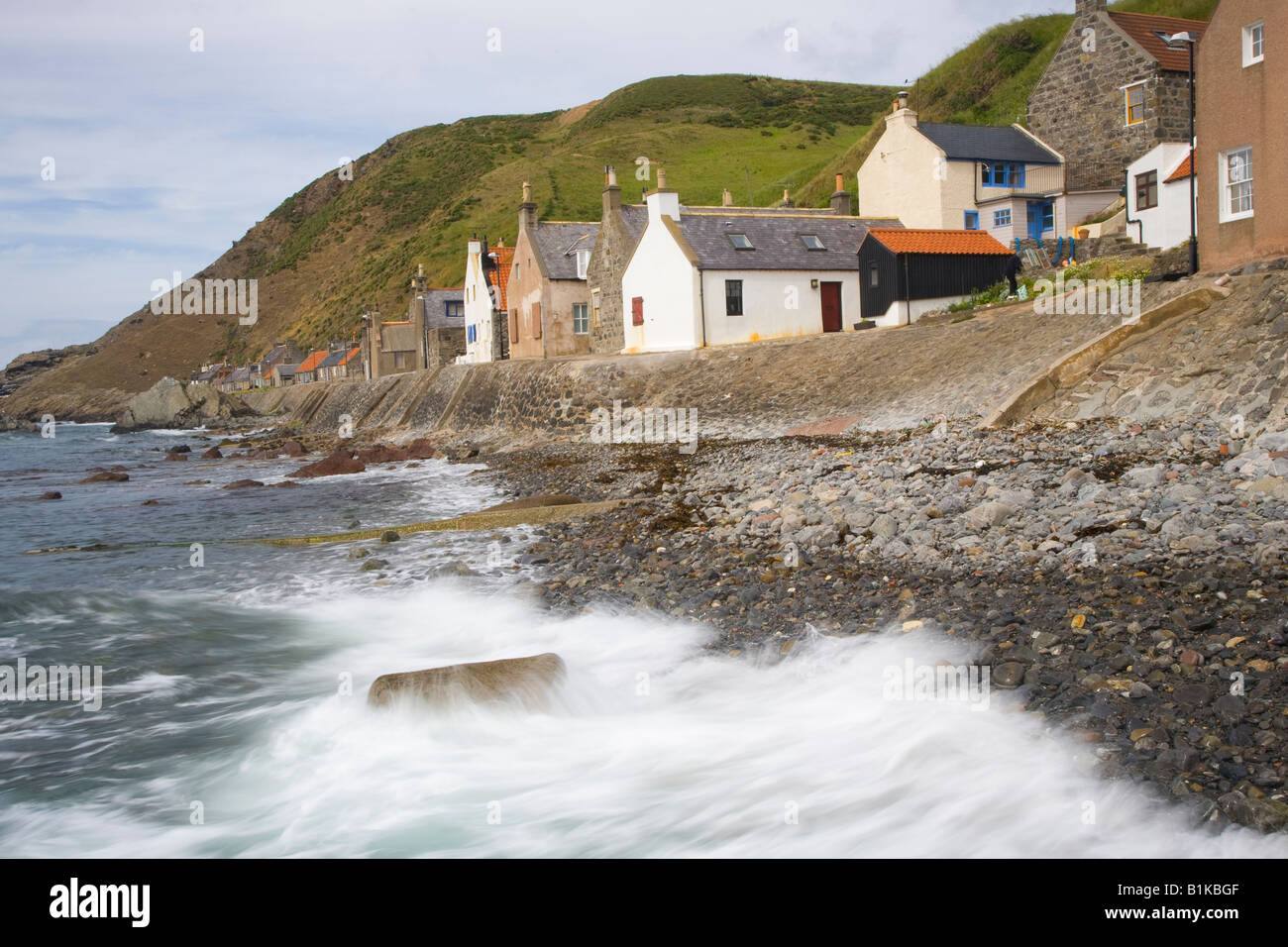 Looking down on Scottish rural houses & rooftops at the seaside coastal