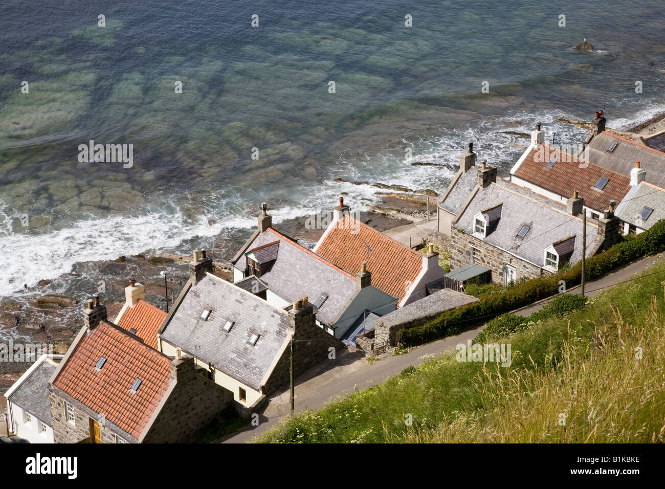 Looking down on Scottish rural houses & rooftops at the seaside coastal village at Gamrie Bay, Crovie, Banff, Banffshire, Aberdeenshire, Scotland UK Stock Photo