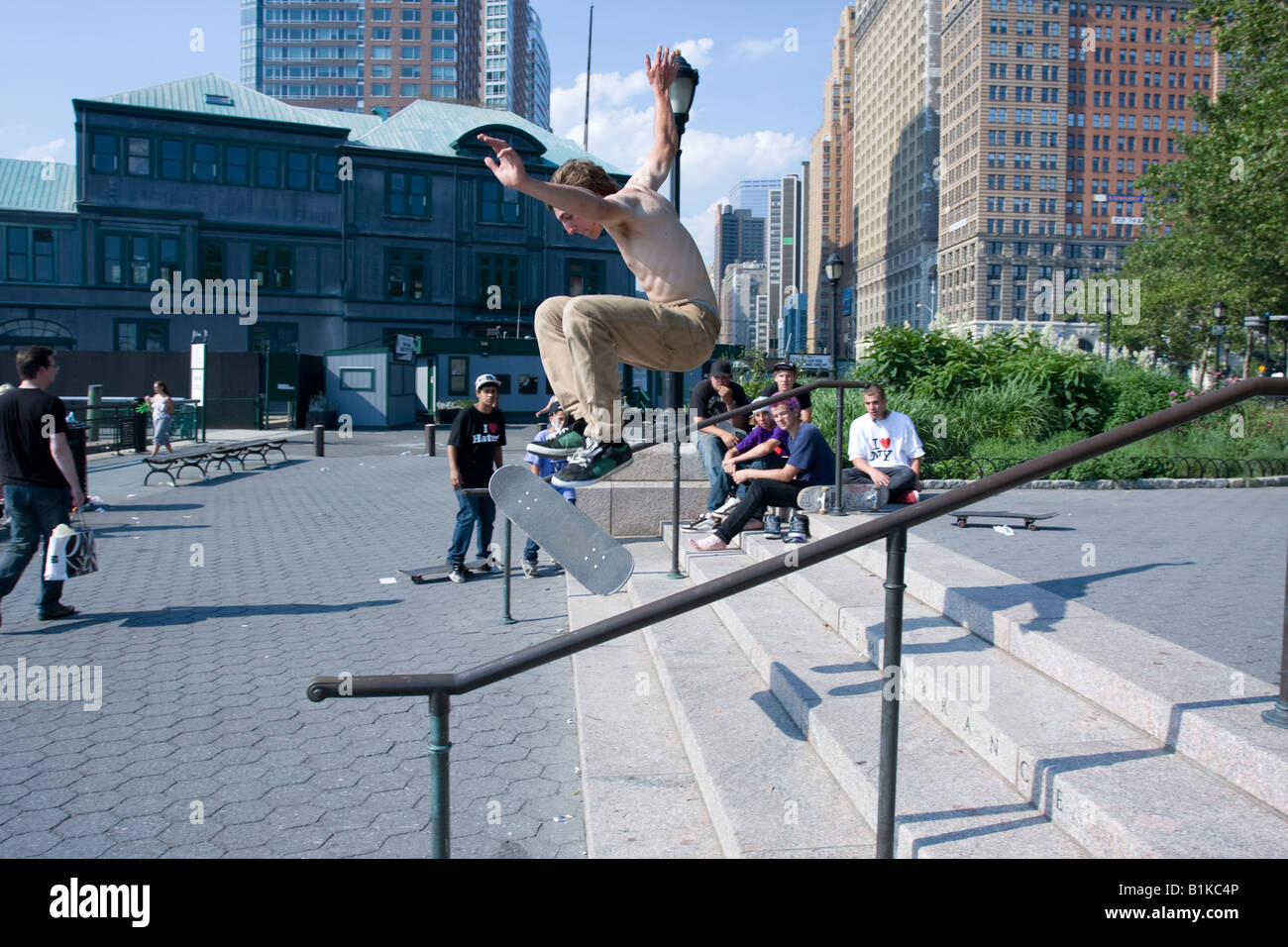 A Skateboarder jumps off some stairs in Battery Park Manhattan, NY. Stock Photo