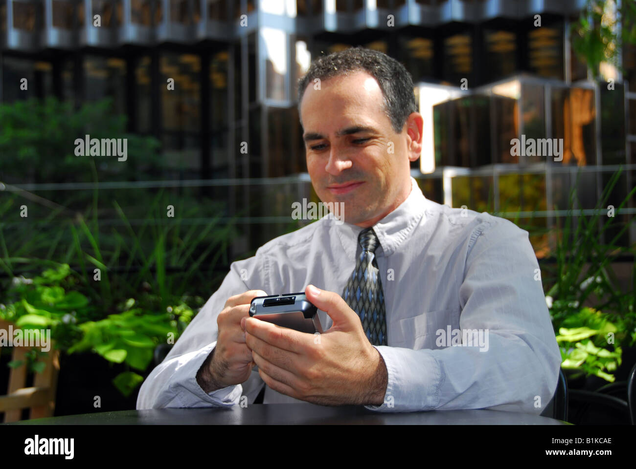 Businessman holding pda focus on hands Stock Photo Alamy