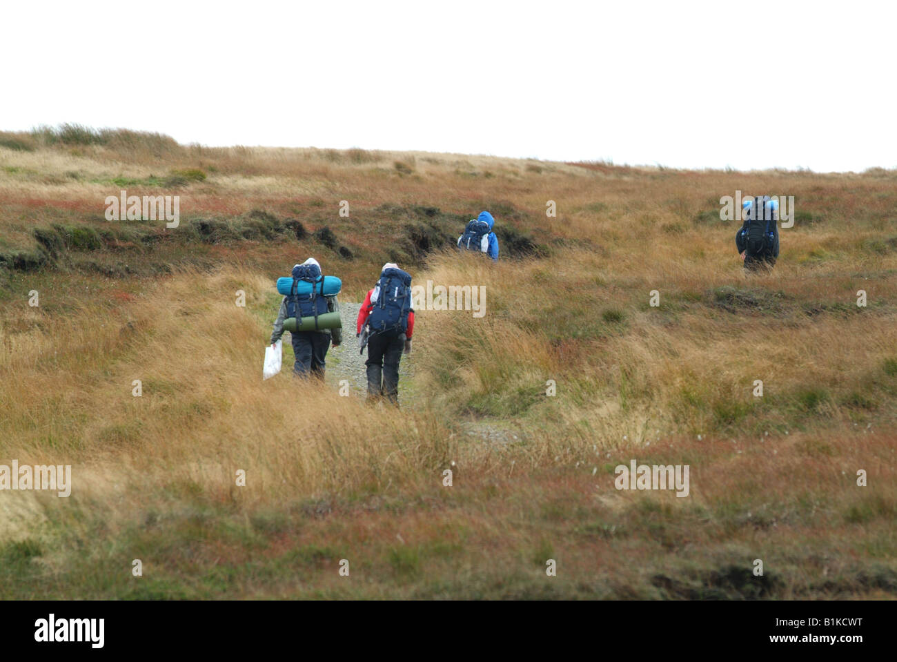 People walking on Saddleworth Moor on the Pennines in Northern England Stock Photo