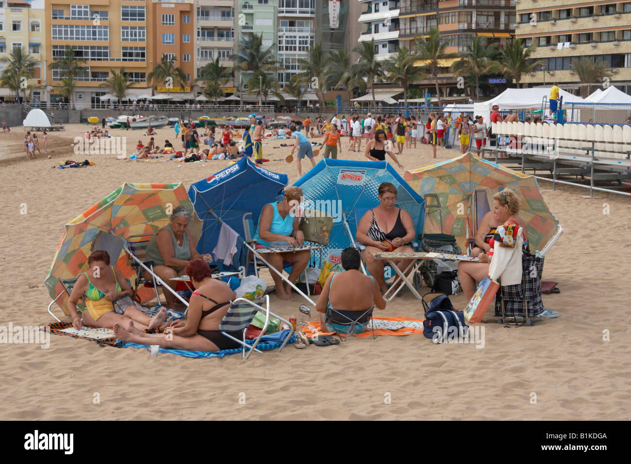 Group of Spanish women playing bingo on the beach. Stock Photo