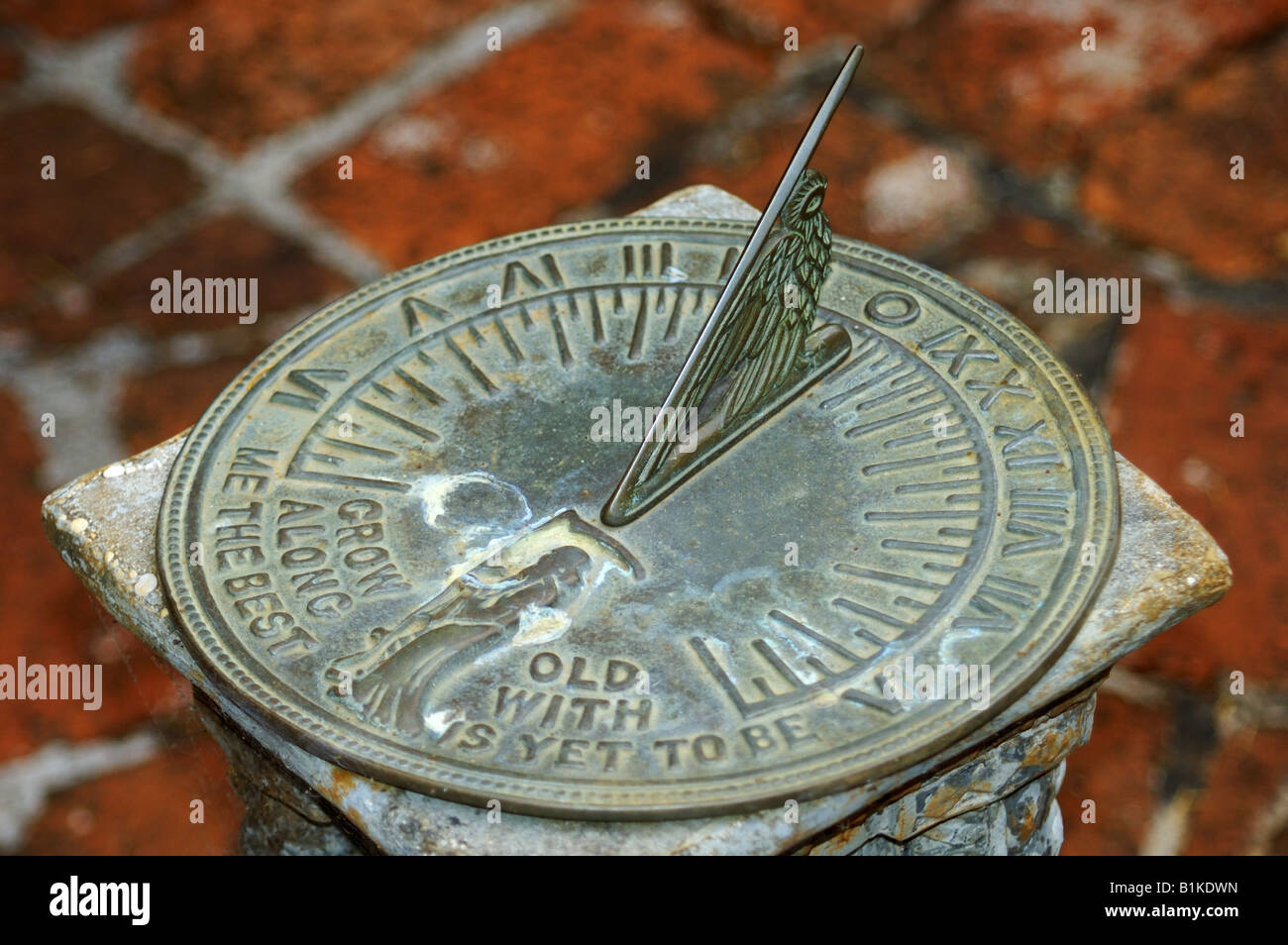 Sundial, against brick paving background Stock Photo - Alamy