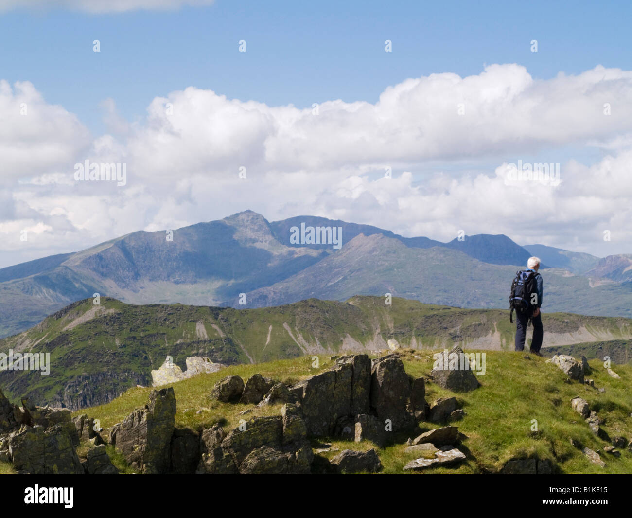 Man walking on Moelwyn Mawr mountain top in Snowdonia National Park in summer. Snowdonia North Wales UK Britain Stock Photo