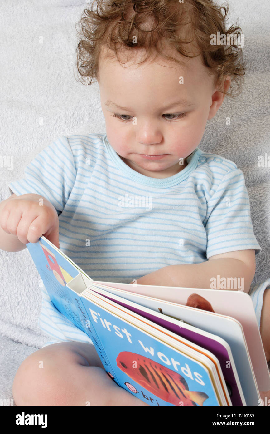 little baby reading book Stock Photo Alamy