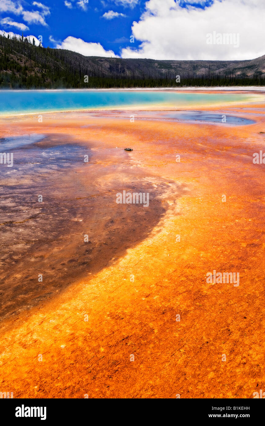 Image looking out over the pools and colorful waters of the Midway Geyser in Yellowstone National Park Stock Photo